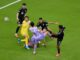 Korea and mexico players fight for the ball